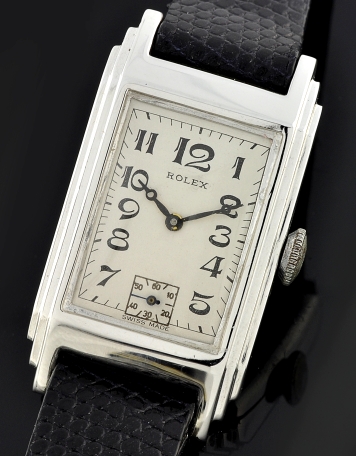 1930s Rolex stainless steel rectangular watch with original art-deco case, restored rhodium plating, and accurate manual winding movement.