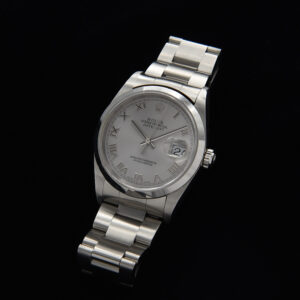 This 2003 Rolex Datejust features a desirable Roman, rhodium dial and comes complete as sold new with inner and outer box plus papers.