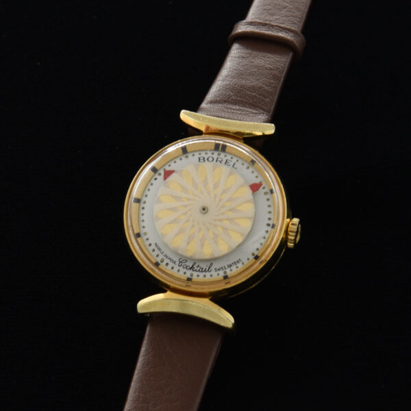 This is a vintage ladies 1960s Borel cocktail watch measuring 25mm in a gold-plated see-through back case.