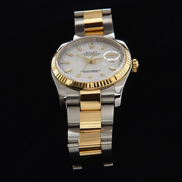 This is a 36mm ref. 116233 Two-Tone Rolex Datejust in 18k-gold and steel with the desirable Rolex Oyster flip-lock bracelet dating to 2008.