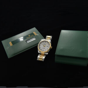 This is a 36mm ref. 116233 Two-Tone Rolex Datejust in 18k-gold and steel with the desirable Rolex Oyster flip-lock bracelet dating to 2008.