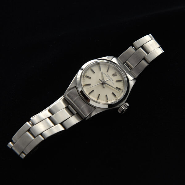 This ladies 1973 Rolex Oyster Perpetual watch displays amazing condition for its age. The 25mm (demure) stainless steel case comes from an era when ladies watches were subtle.