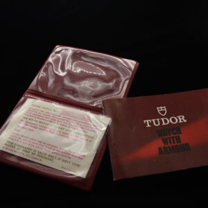 This is an early 1980s Tudor vinyl holder with open papers and instruction booklet for many vintage Tudor watches including the chronographs and Submariner.