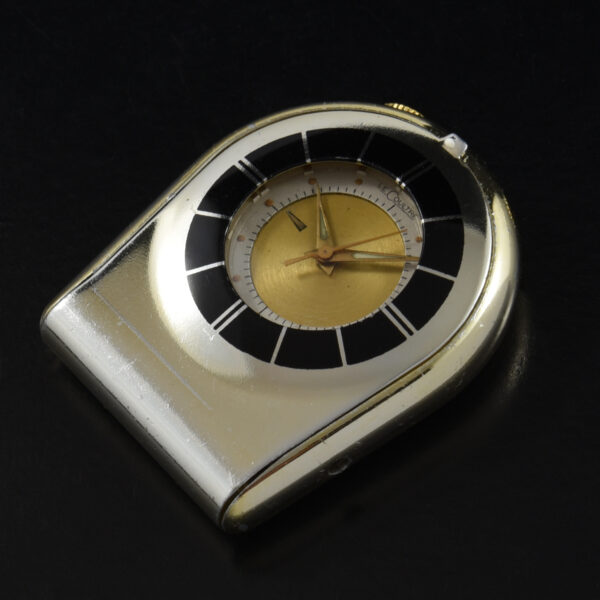 This is a vintage 1950s LeCoultre Memovox alarm folding table-side or pocket watch measuring 37x53mm in gold plate and steel.