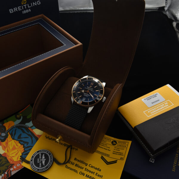 This is a 2018 Breitling Superocean Heritage B20 Automatic 42mm steel and red gold watch complete with box and papers.