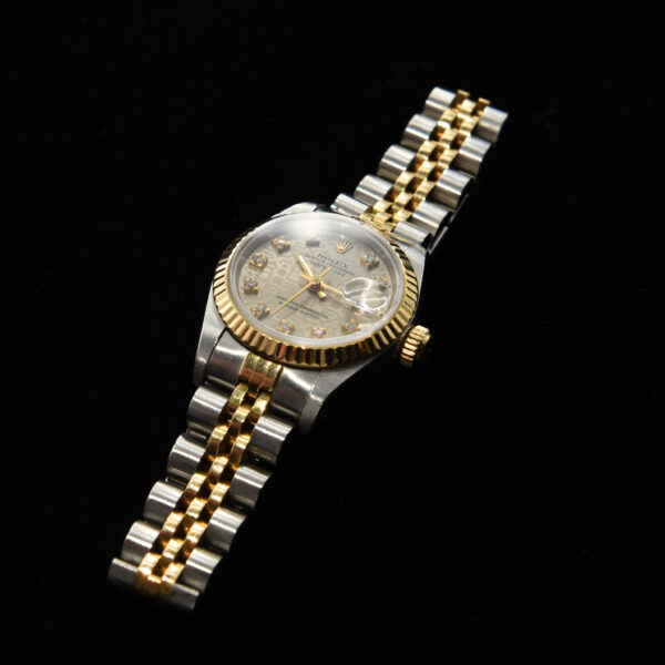 This is an exceptional ladies 1988 Rolex Datejust with a factory original diamond, Jubilee dial. The Jubilee dial (Rolex motif on the dial) was discontinued and has been recently brought back due to demand.