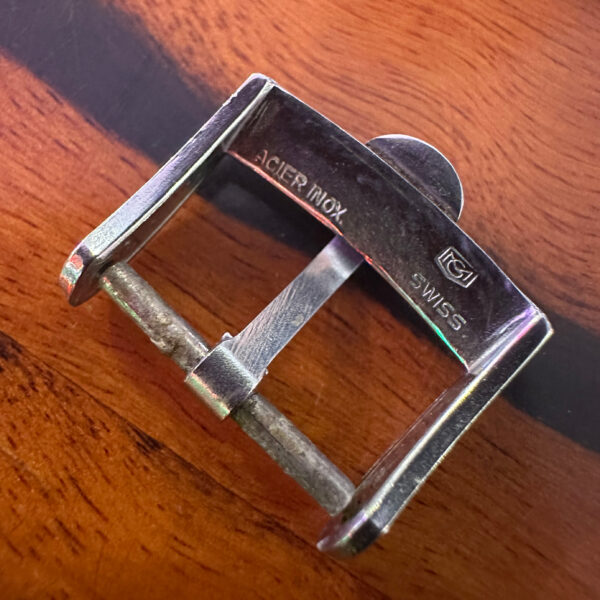 Authentic men's Omega steel buckle measuring 15.5mm inside and 18mm outer. These fit most 18mm straps. We have many different vintage Omega buckles available.