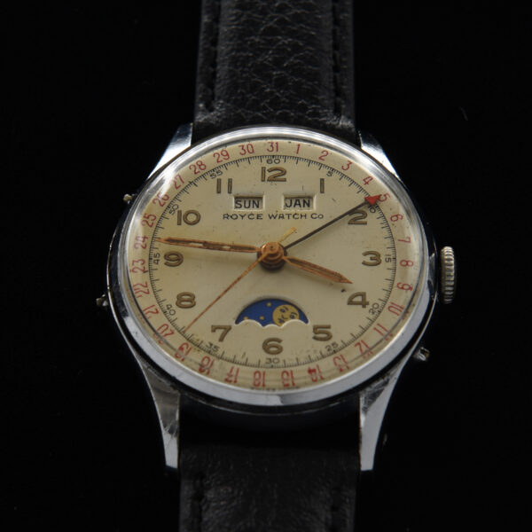 This is a vintage 1950s Royce Triple-Date-Moon phase. The caliber 90 movement complication provides the day, date, month, hours, minutes and seconds, along with the phases of the moon.