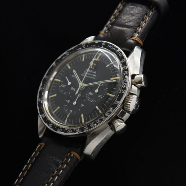 Here is a 1967 Omega Speedmaster 145.012 Cal 321 Pre-Moon stainless steel vintage 42mm watch. This watch is honest; having the original and rare dot-over-90 bezel.