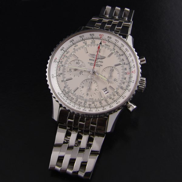 This is a circa 2000 limited edition (2000 produced) Breitling Navitimer B1 model B0123 in stainless steel with the original steel bracelet.