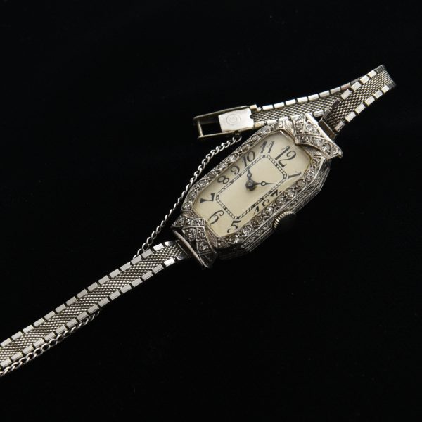 This is a beautiful vintage 1930s platinum and diamond watch measuring 16.5x32.5mm, which is actually considered large from this era.