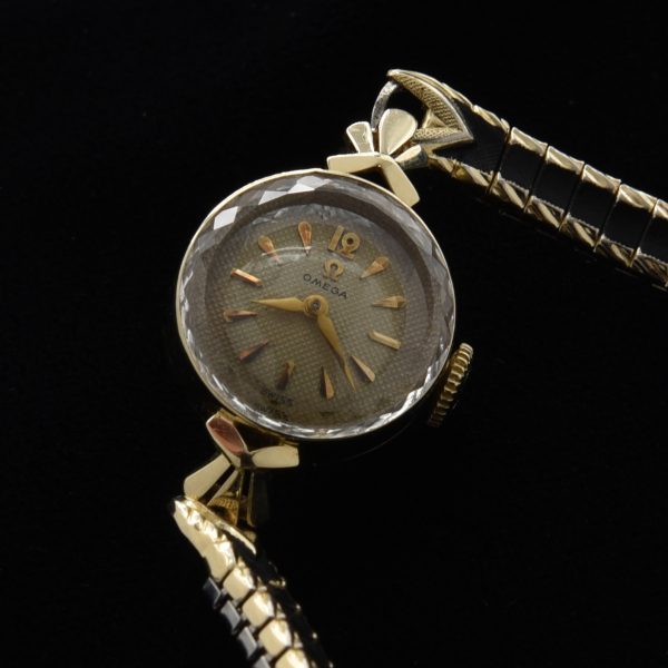 This is a barely used 1958 Ladies 14k solid gold Omega Sapphette cocktail watch having the cut-glass-beveled crystal.