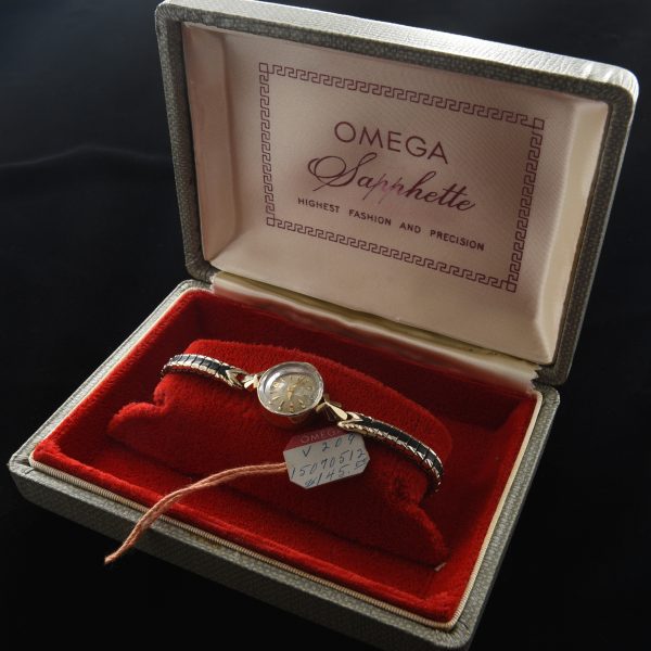 This is a barely used 1958 Ladies 14k solid gold Omega Sapphette cocktail watch having the cut-glass-beveled crystal.