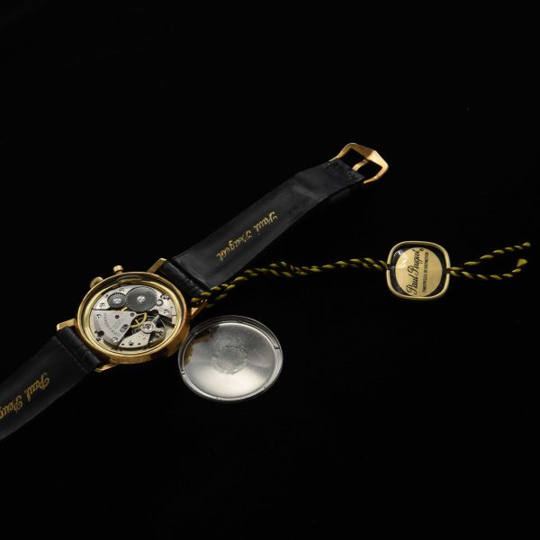 This is such a cool find that came from a jeweller's unused and unsold 1970s stock! This Paul Peugeot manual winding chronograph watch measures 34mm in a gold-plated case with stainless steel screw-back.