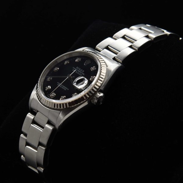 This men's 36mm Rolex Datejust has a black factory diamond dial that absolutely sparkles! The Rolex Oyster case looks absolutely amazing.