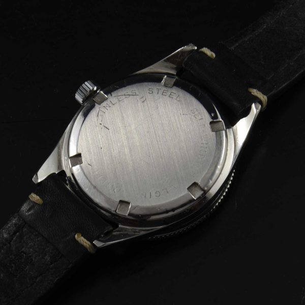 This is a very uncommon vintage 1960s Elgin Dive watch having a very cool radium dial. The Mercedes hands were replaced at some time and really suit the watch.