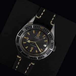 This is a very uncommon vintage 1960s Elgin Dive watch having a very cool radium dial. The Mercedes hands were replaced at some time and really suit the watch.