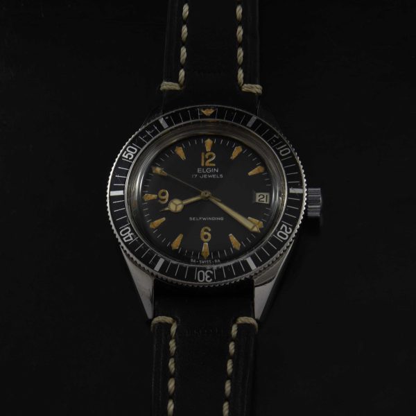 This is a very uncommon vintage 1960s Elgin Dive watch having a very cool radium dial. The Mercedes hands were replaced at some time and really suit the watch.