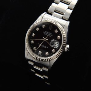 This men's 36mm Rolex Datejust has a black factory diamond dial that absolutely sparkles! The Rolex Oyster case looks absolutely amazing.