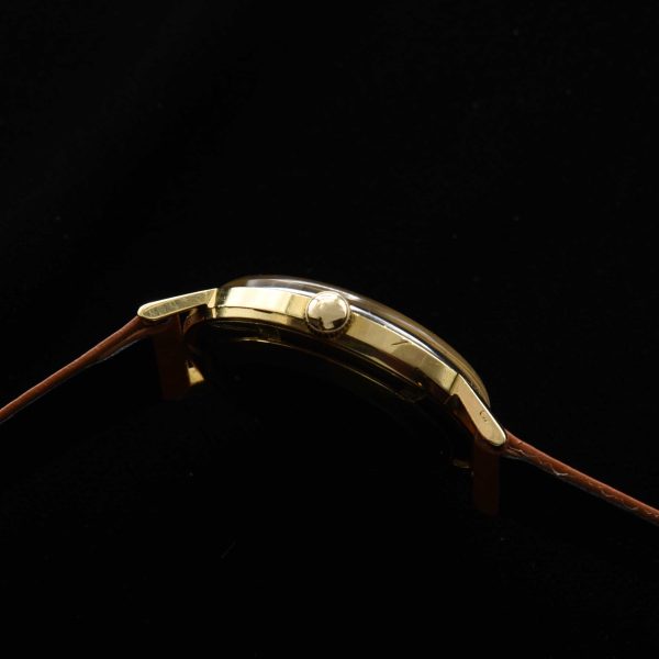 This is a spectacular and uncommon 18k-solid-gold 1960s vintage Movado Kingmatic with a heavy solid-gold-screw-back case.