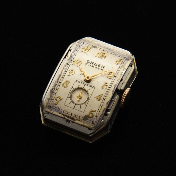 This is a very uncommon 1938 Gruen Extreme Driver’s watch known as the “edge-of-wrist watch” measuring 20x37mm with its 14k-gold-filled highly curved case.