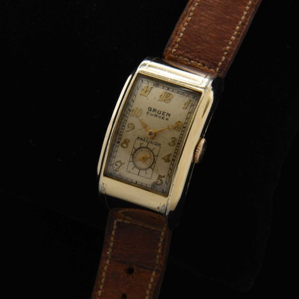 This is a very uncommon 1938 Gruen Extreme Driver’s watch known as the “edge-of-wrist watch” measuring 20x37mm with its 14k-gold-filled highly curved case.
