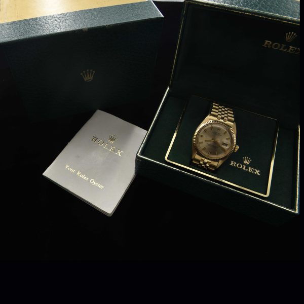 This incredibly preserved 1969 Rolex Datejust measuring 36mm in solid-14k-gold comes complete with its box and original guarantee certificate having matching punched serial numbers.