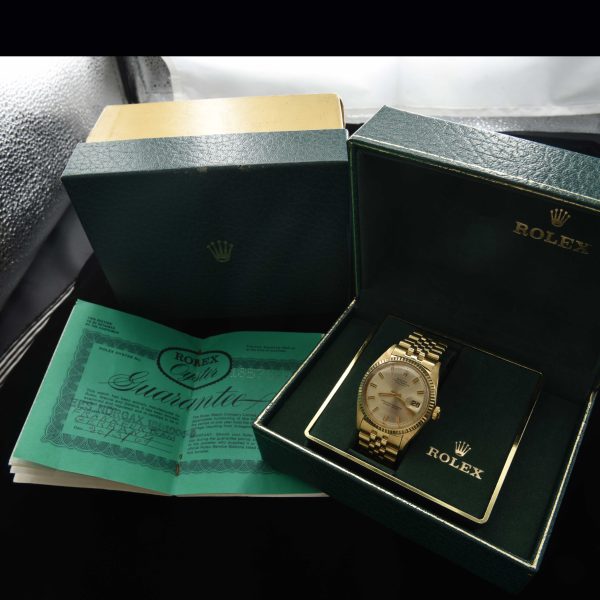 This incredibly preserved 1969 Rolex Datejust measuring 36mm in solid-14k-gold comes complete with its box and original guarantee certificate having matching punched serial numbers.