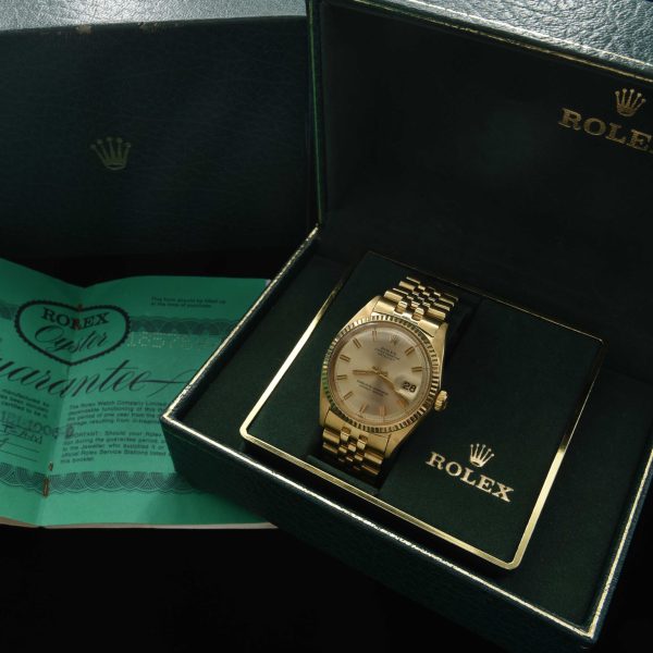 This incredibly preserved 1969 Rolex Datejust measuring 36mm in solid-14k-gold comes complete with its box and original guarantee certificate having matching punched serial numbers.