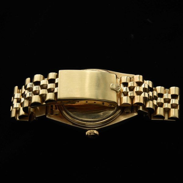 This incredibly preserved 1969 Rolex Datejust measuring 36mm in solid-14k-gold comes complete with its box and original guarantee certificate having matching punched serial numbers.