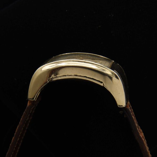 This is a very uncommon 1938 Gruen Extreme Driver’s watch known as the “edge-of-wrist watch” measuring 20x37mm with its 14k-gold-filled highly curved case.