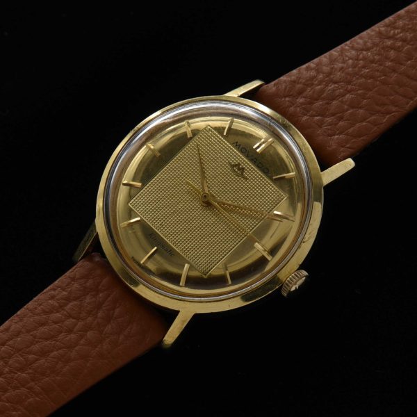 This is a spectacular and uncommon 18k-solid-gold 1960s vintage Movado Kingmatic with a heavy solid-gold-screw-back case.