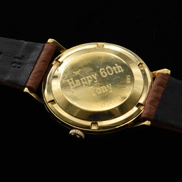 This is a spectacular and uncommon 18k-solid-gold 1960s vintage Movado Kingmatic with a heavy solid-gold-screw-back case.
