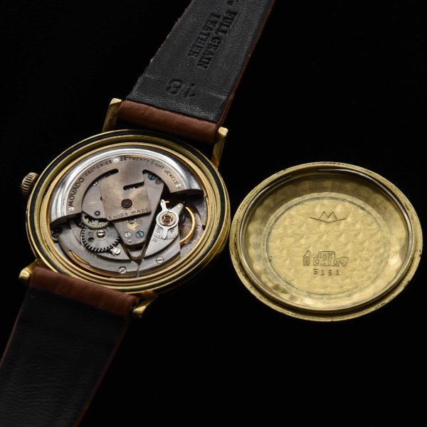 This is a spectacular and uncommon 18k-solid-gold 1960s vintage Movado Kingmatic with a heavy solid-gold-screw-back case.