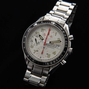 This 1996 Omega Speedmaster "Japanese Racing" has an uncommon polar-white dial with radiating-etched pattern with striking red and black accents.