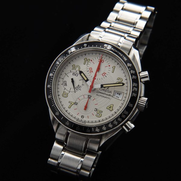 This 1996 Omega Speedmaster "Japanese Racing" has an uncommon polar-white dial with radiating-etched pattern with striking red and black accents.