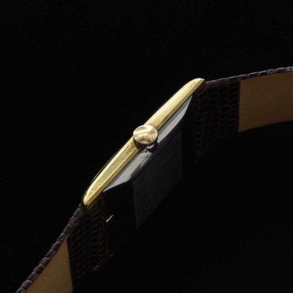 This is a very rare 1970s vintage Universal Geneve having an elongated, heavily gold-plated case, with a stainless steel signed back measuring a sleek and thin 22x37x7mm.