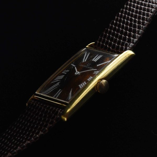 This is a very rare 1970s vintage Universal Geneve having an elongated, heavily gold-plated case, with a stainless steel signed back measuring a sleek and thin 22x37x7mm.