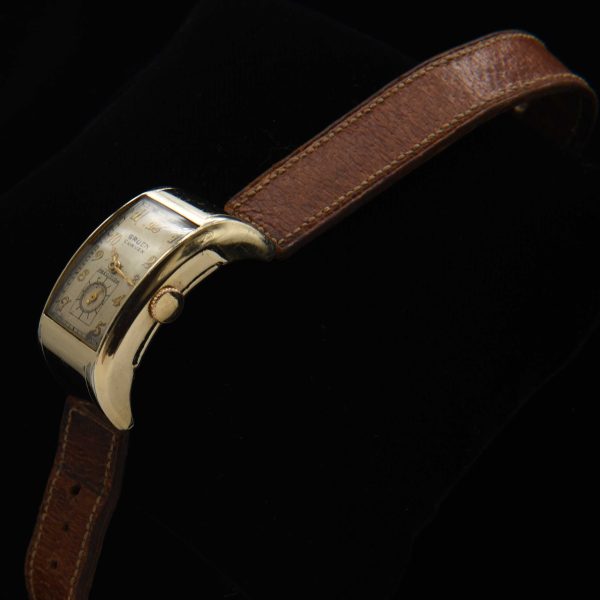This is a very uncommon 1938 Gruen Extreme Driver’s watch known as the “edge-of-wrist watch” measuring 20x37mm with its 14k-gold-filled highly curved case.