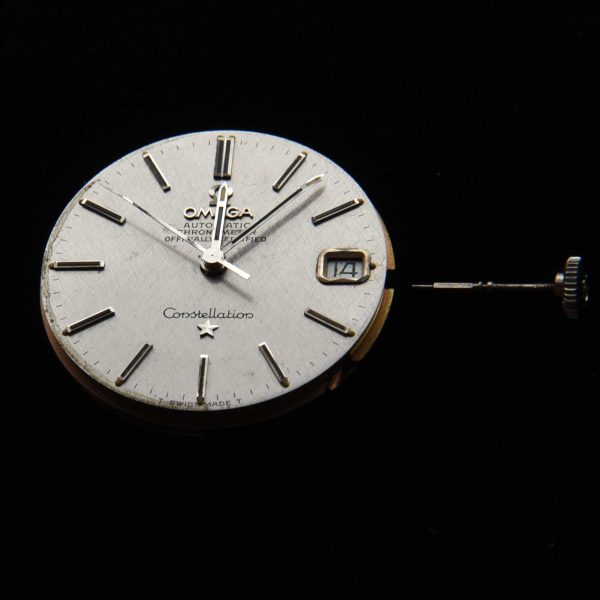 This is an original textured dark-silver Omega Constellation (original) dial and hands with its cal. 564 (working) movement.
