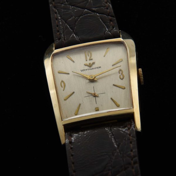 This is an interesting and uncommon '50s Wittnauer known as the 'grasshopper' because of its shape resembling the head of the insect.