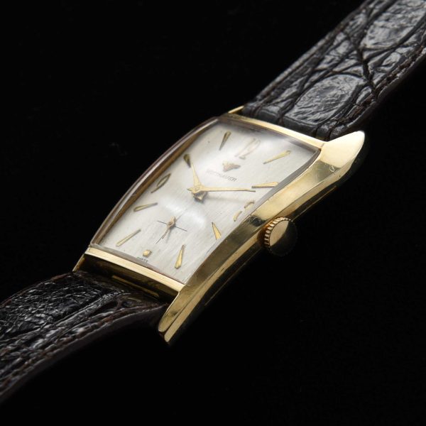 This is an interesting and uncommon '50s Wittnauer known as the 'grasshopper' because of its shape resembling the head of the insect.