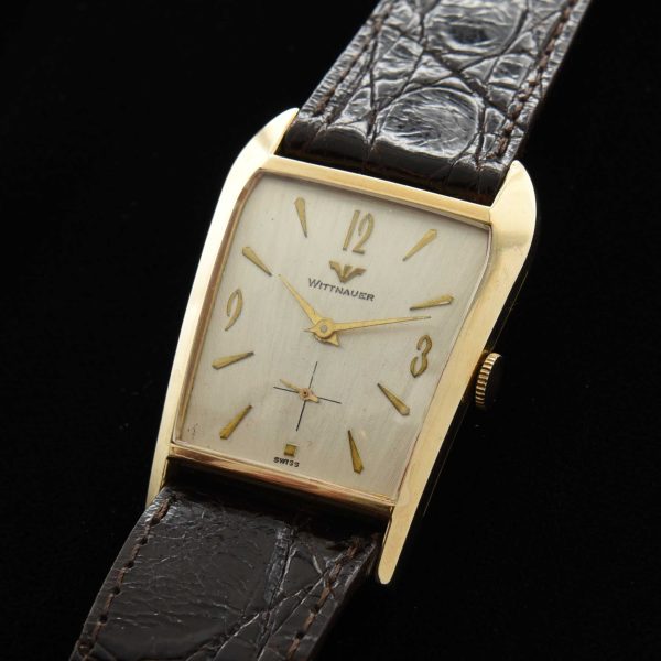 This is an interesting and uncommon '50s Wittnauer known as the 'grasshopper' because of its shape resembling the head of the insect.