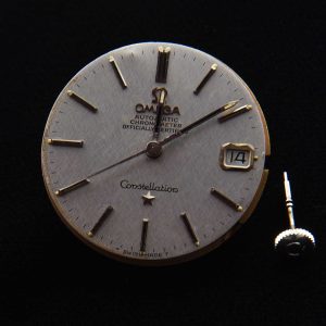This is an original textured dark-silver Omega Constellation (original) dial and hands with its cal. 564 (working) movement.
