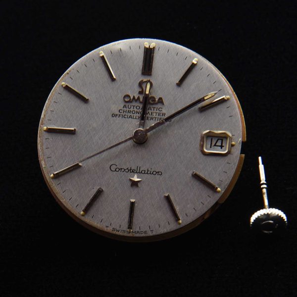 This is an original textured dark-silver Omega Constellation (original) dial and hands with its cal. 564 (working) movement.