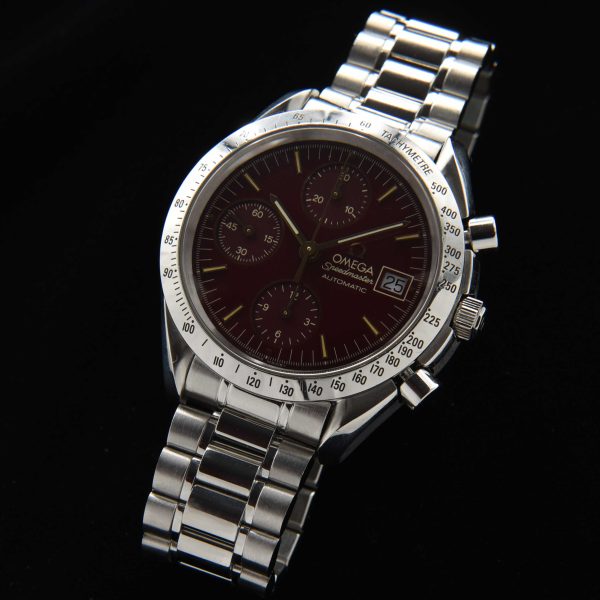 This is a very uncommon reference 3511.61 Omega Speedmaster with a seldom seen burgundy dial and known as the 'Marui', and was sold in Japan in very limited numbers in the '90s. 