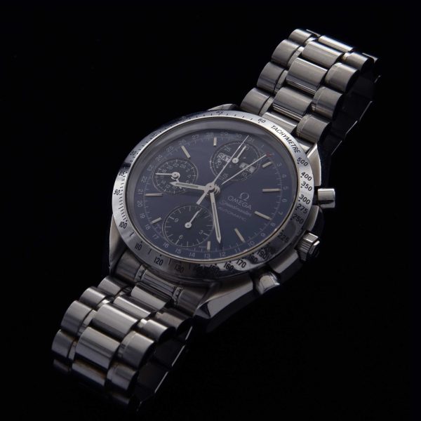 This 39mm stainless steel Omega Speedmaster triple-date chronograph checks all the boxes.