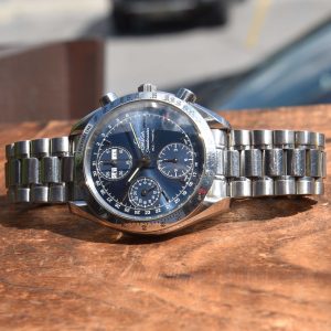 This 39mm stainless steel Omega Speedmaster triple-date chronograph checks all the boxes.