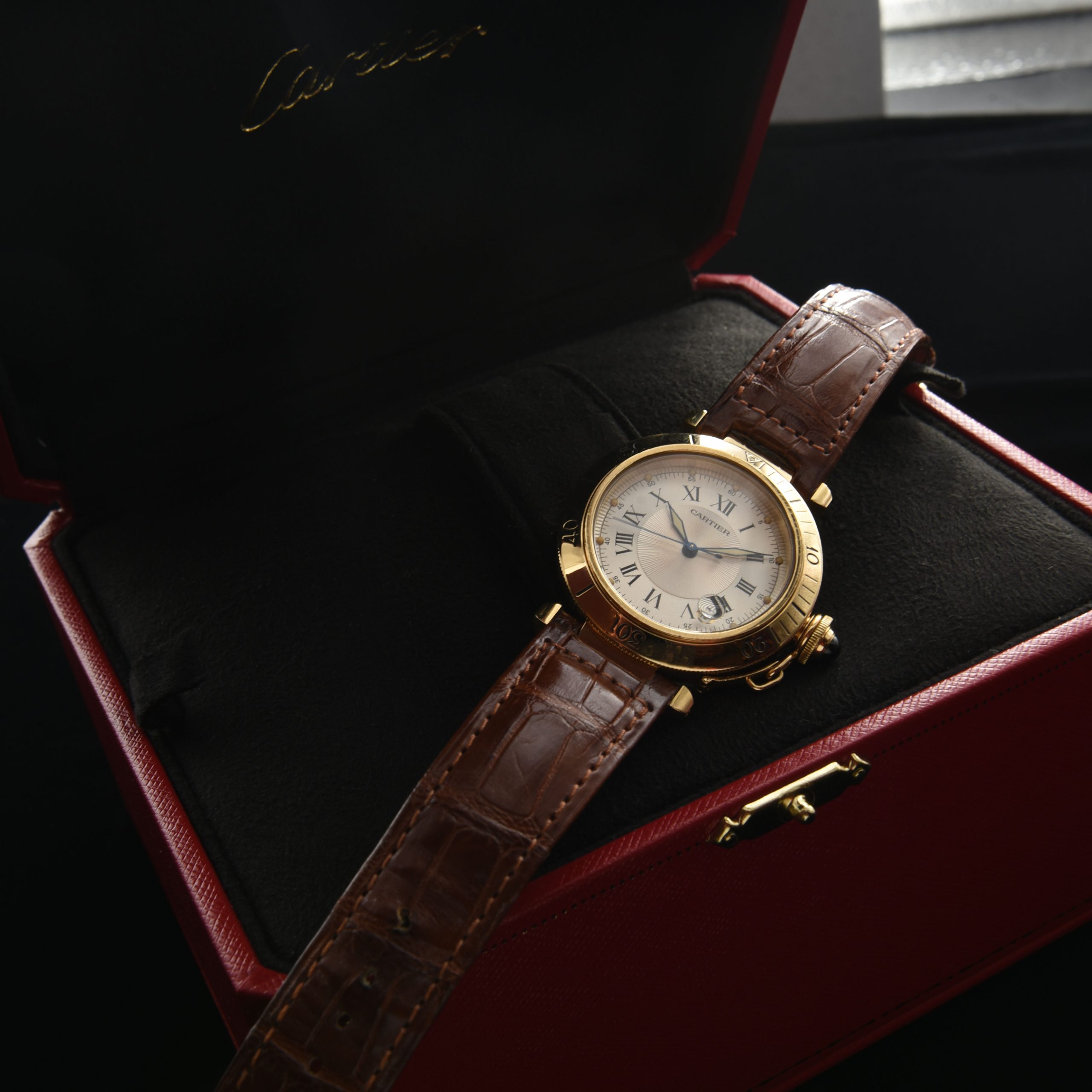 This solid-18k-gold circa 2000s Cartier Pasha ref. 1027 displays excellent overall condition, and comes with the Cartier box.