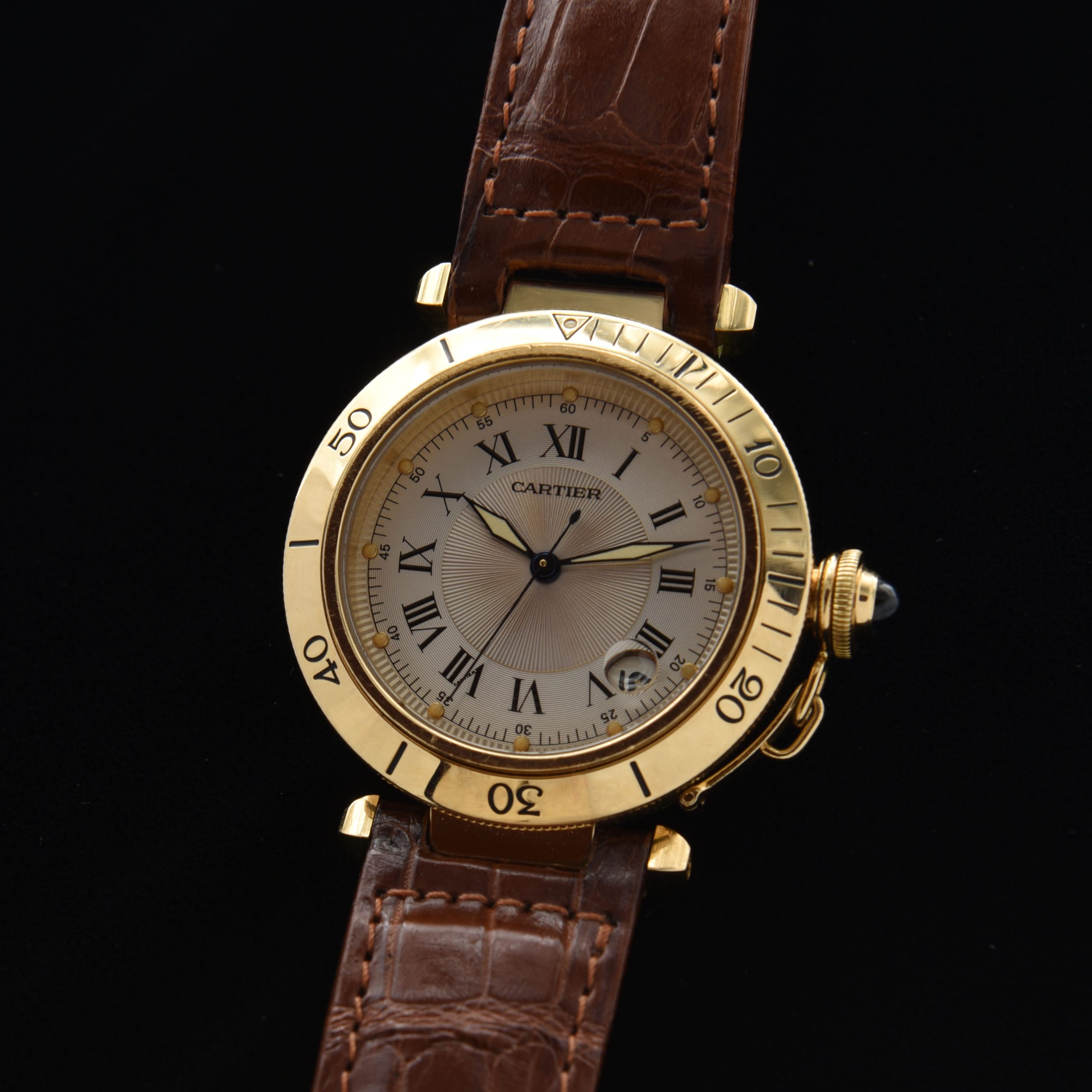 This solid-18k-gold circa 2000s Cartier Pasha ref. 1027 displays excellent overall condition, and comes with the Cartier box.